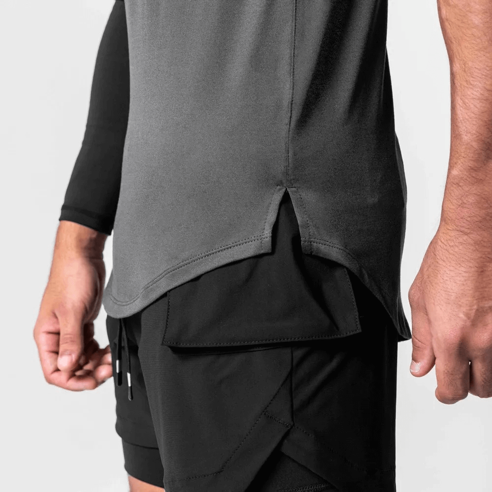 Men's gym tank top with asymmetric hem in grey, featuring breathable polyester fabric, perfect for workouts.